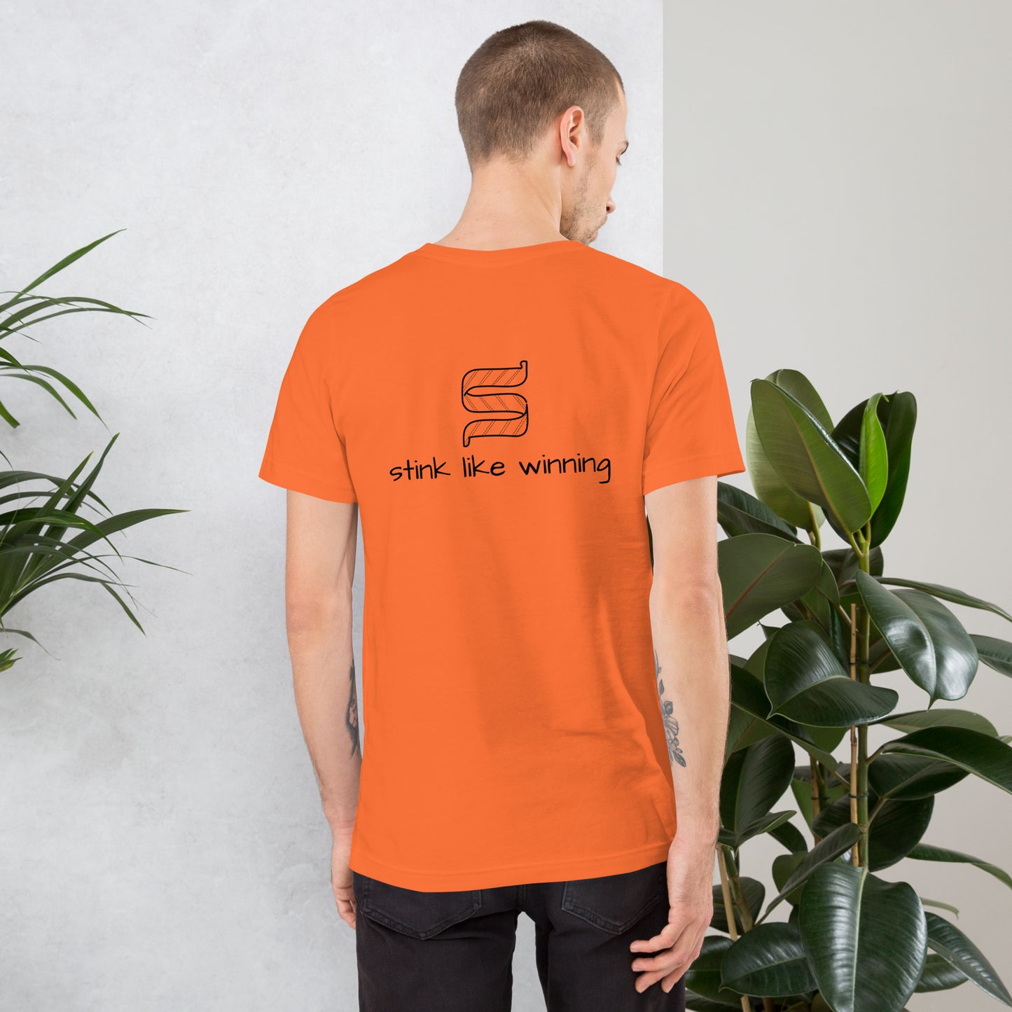 Designer t-shirt showcasing "Stink Like Winning" back for hockey fans.