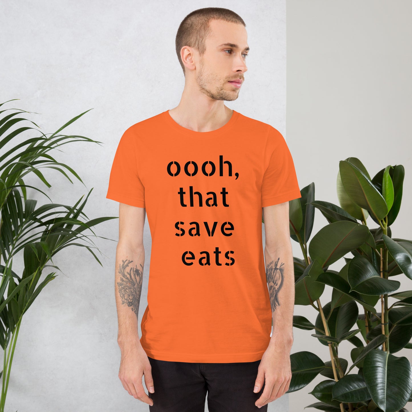 Eye-catching "That Save Eats" and "Stink Like Winning" graphics on a bold color designer t-shirt