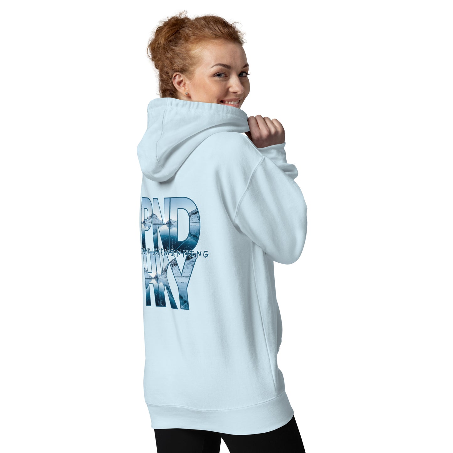 A woman wearing a sky blue hoodie with Pond Hockey Printed on it | Stink Like Winning 